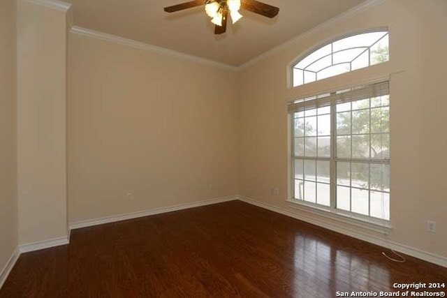 Dining room before — empty space with ceiling fan and bare hardwood floors